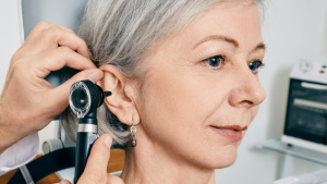 woman getting her ears checked at the audiologist
