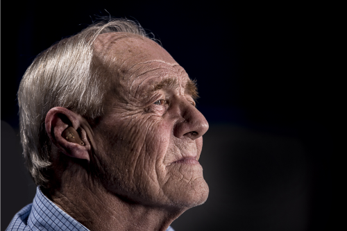 Elderly Man with a hearing aid