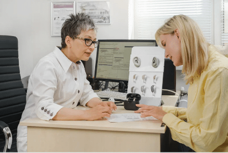 audiologist and patient in hearing loss consultation