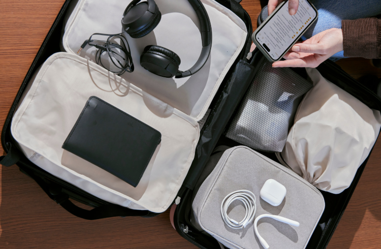 person packing audio equipment for travel