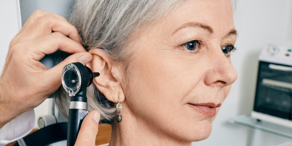 tinnitus woman getting her ears checked at the audiologist